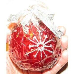 At Home brand red and silver Christmas ball shaped candle, new